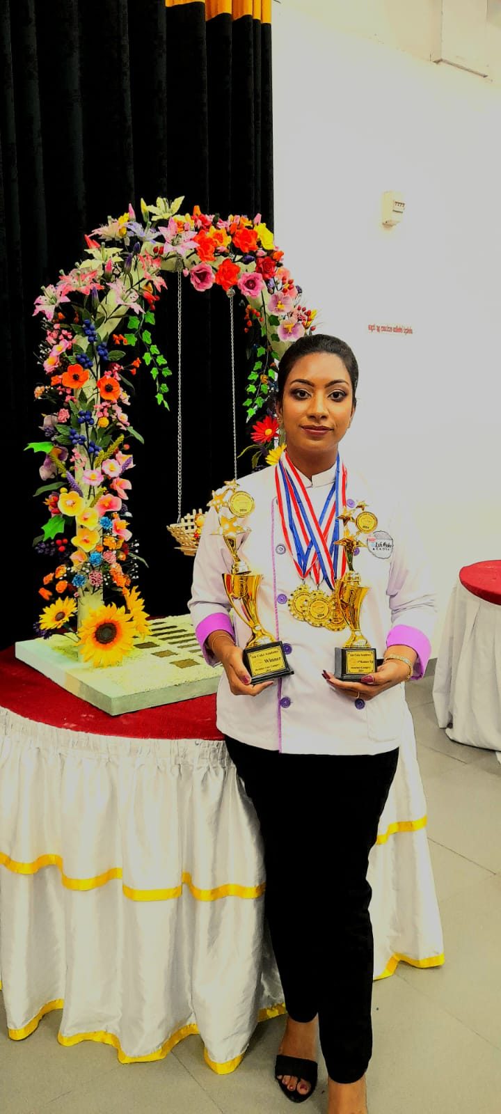 Malsha with her trophies and medals