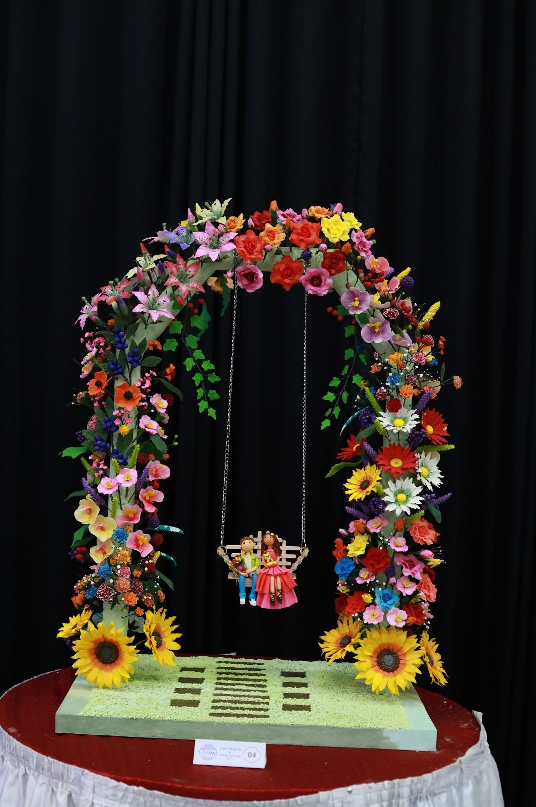 Sugar flower swing — every flower hand-made from sugar