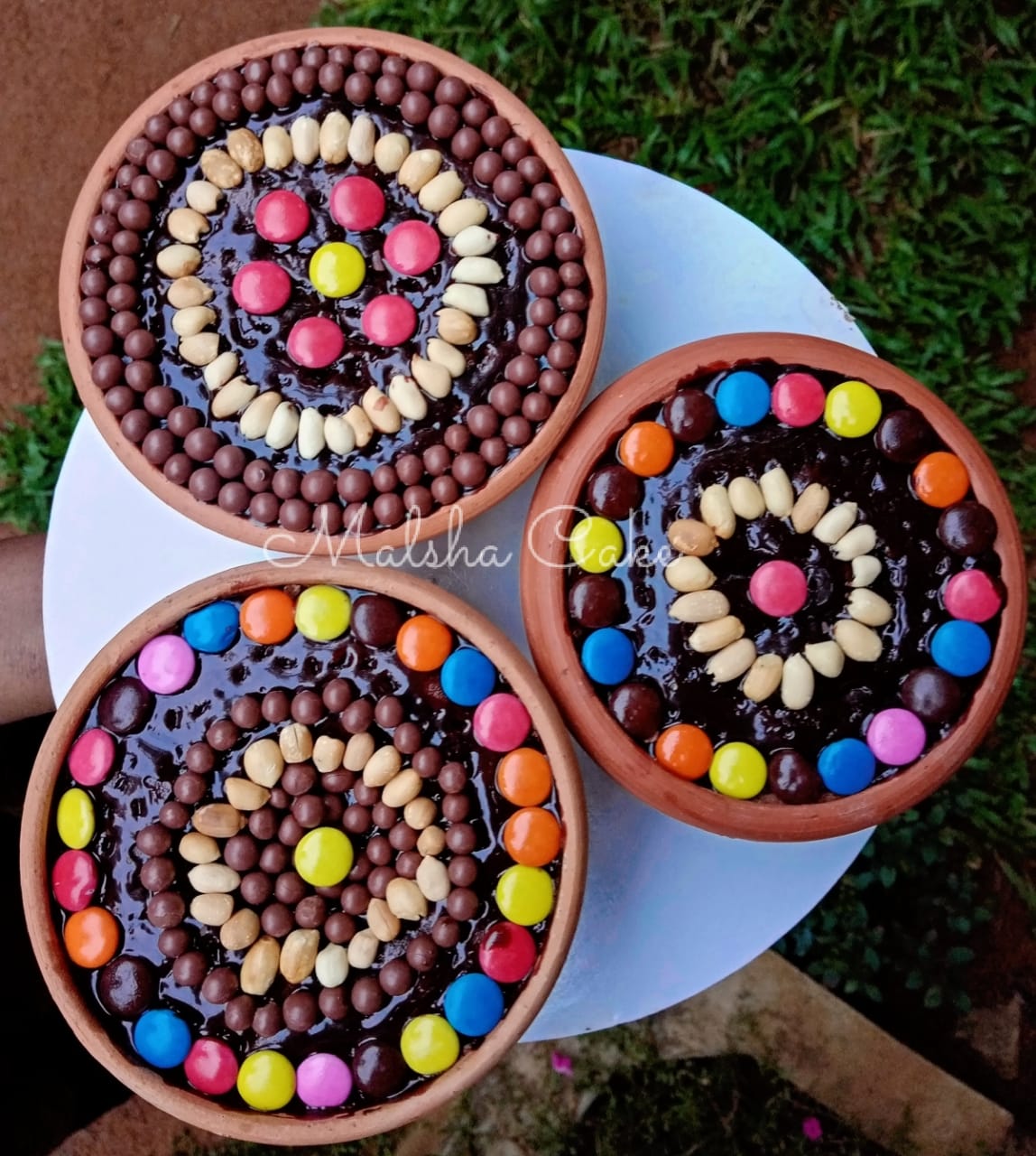 Chocolate pot cakes with nuts and chocolate buttons