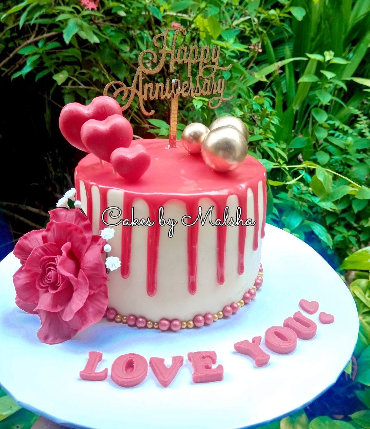 Anniversary cake with red sugar roses