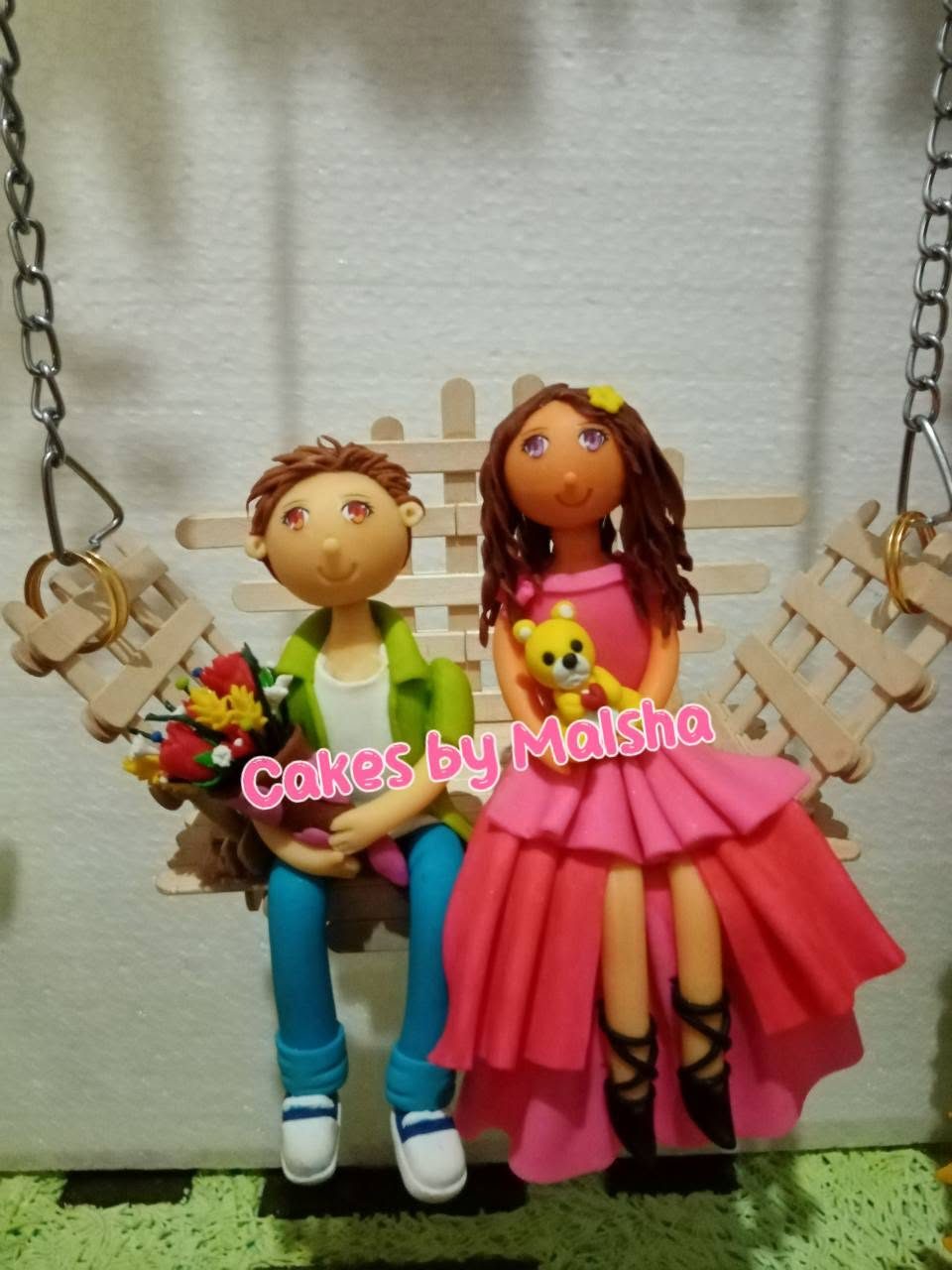 Sugar couple on a swing — anniversary cake topper