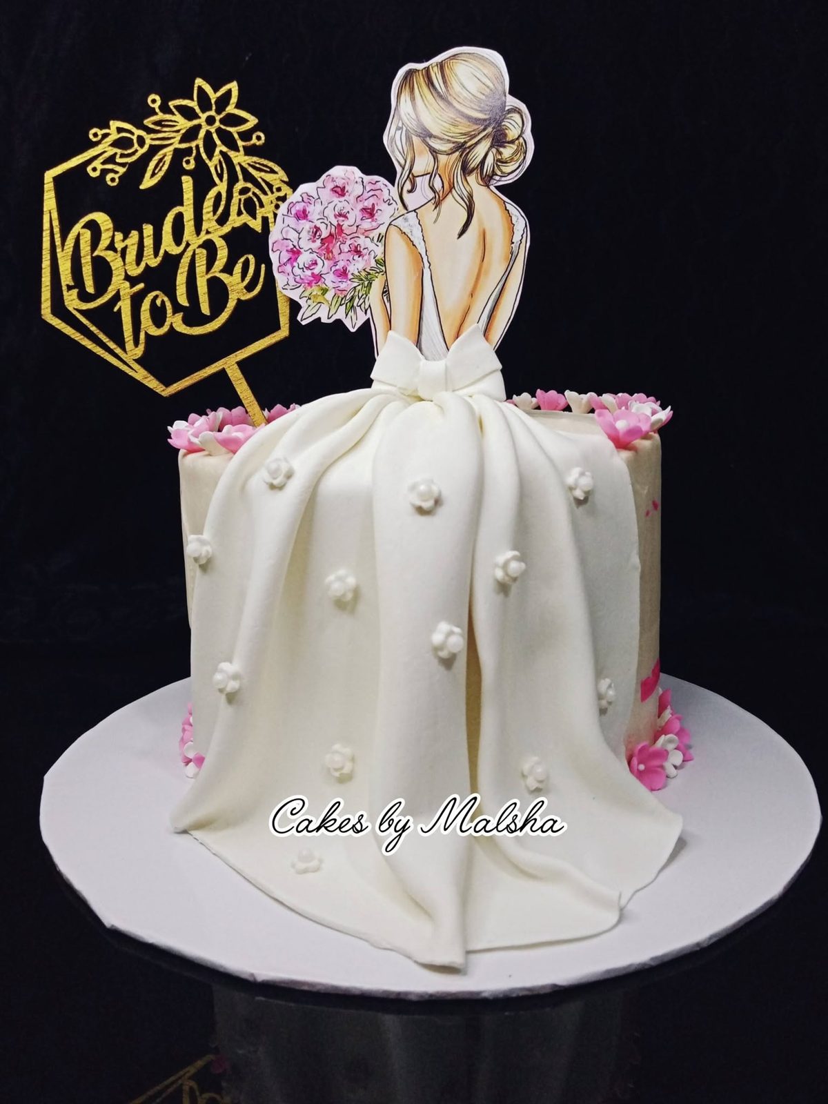 Bride-to-be cake with a sugar wedding dress