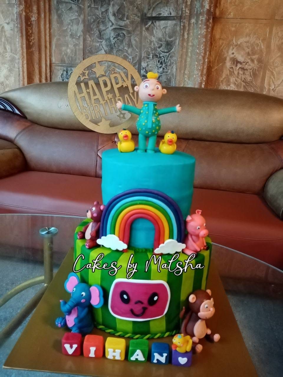 Cocomelon-themed kids' birthday cake