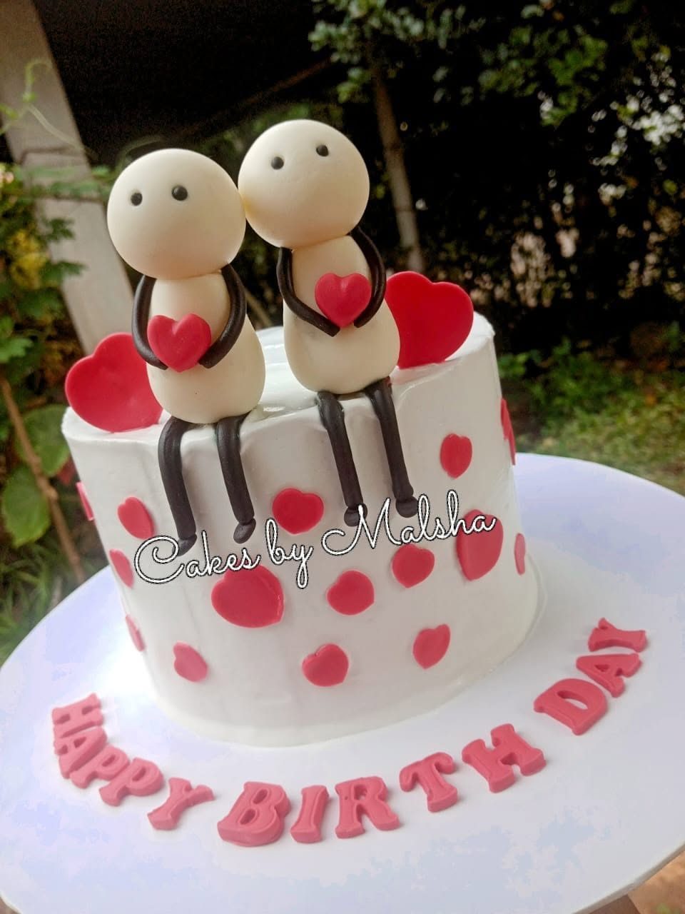 Birthday cake with a sugar couple on top