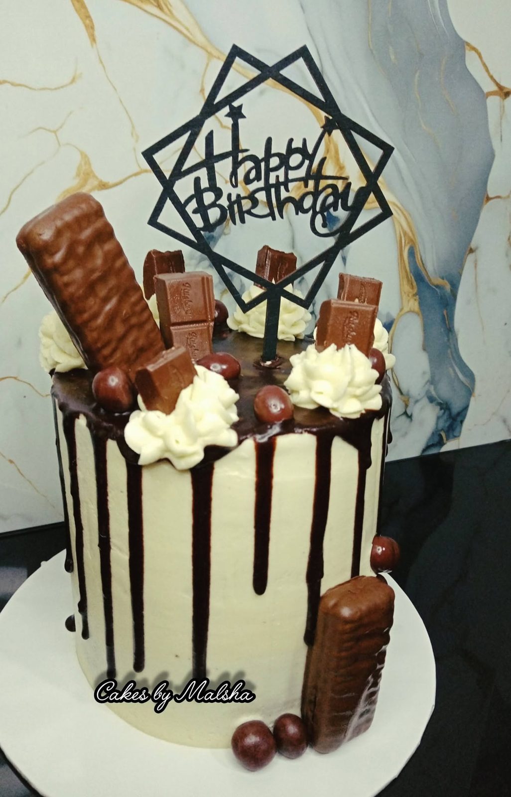 Chocolate drip cake with chocolate bars