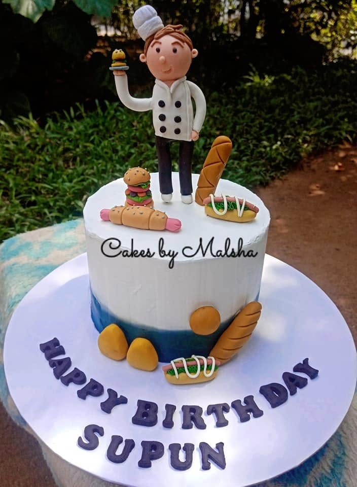 Chef-themed birthday cake with a hand-made sugar chef