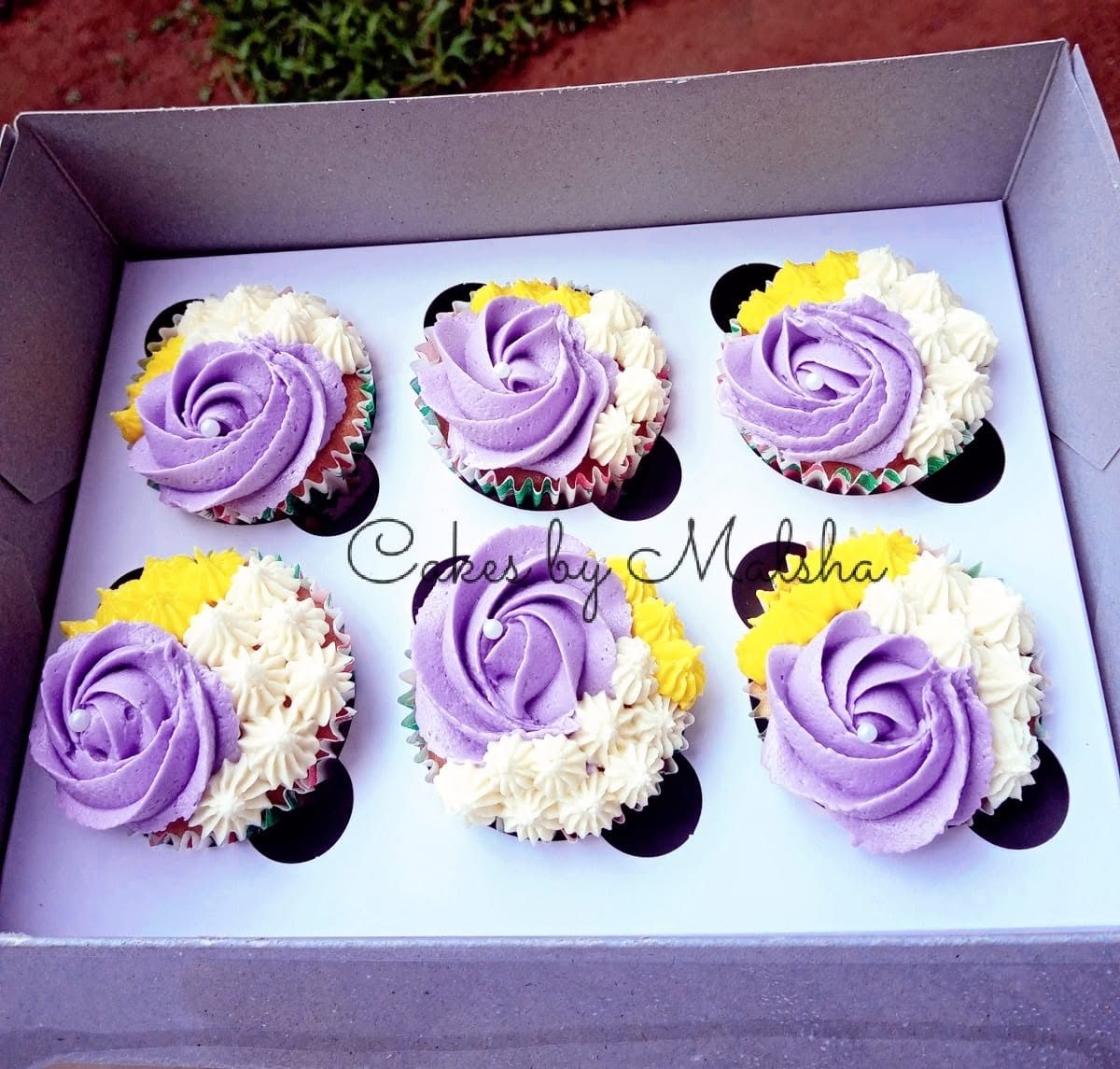 Box of six purple rose cupcakes