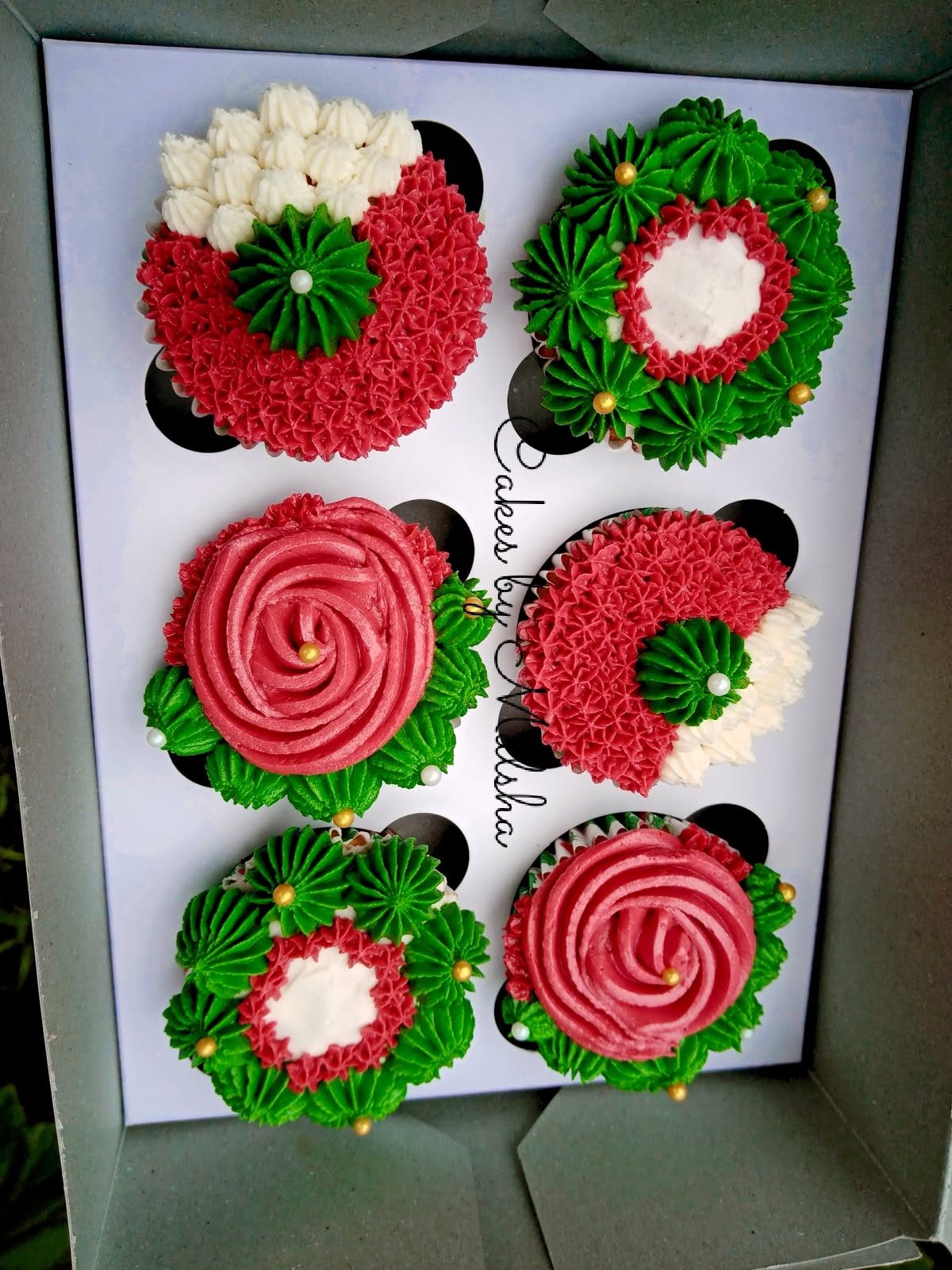 Red and green buttercream rose cupcakes